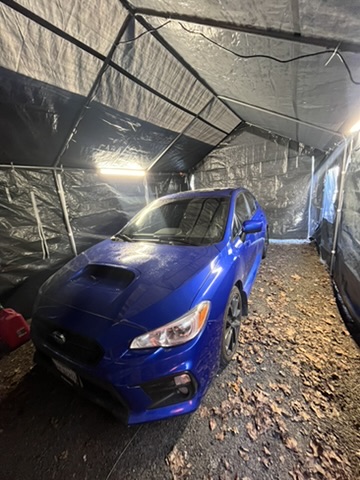 Refresh Mobile Detailing applying ceramic protection to a Subaru